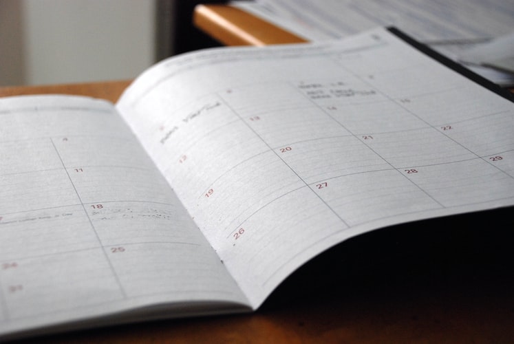 An individual using a planner to plan their day at Lexington IOP