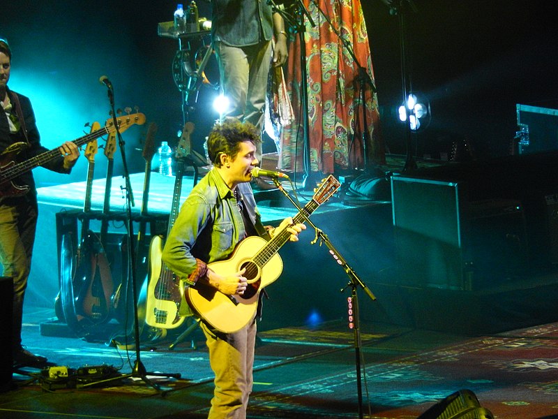 John Mayer performing at a live concert