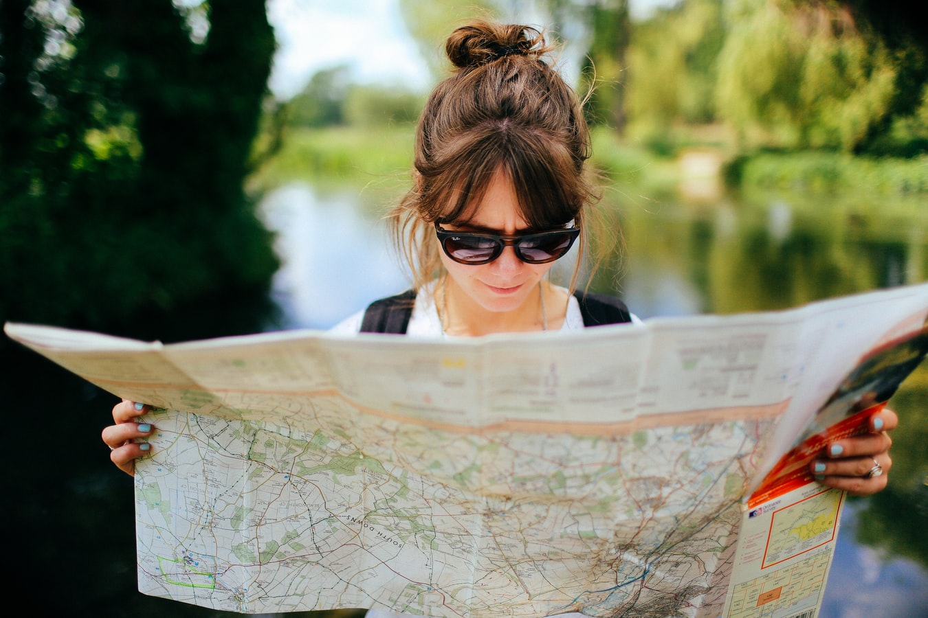 A woman looking at a map trying to locate a detox center