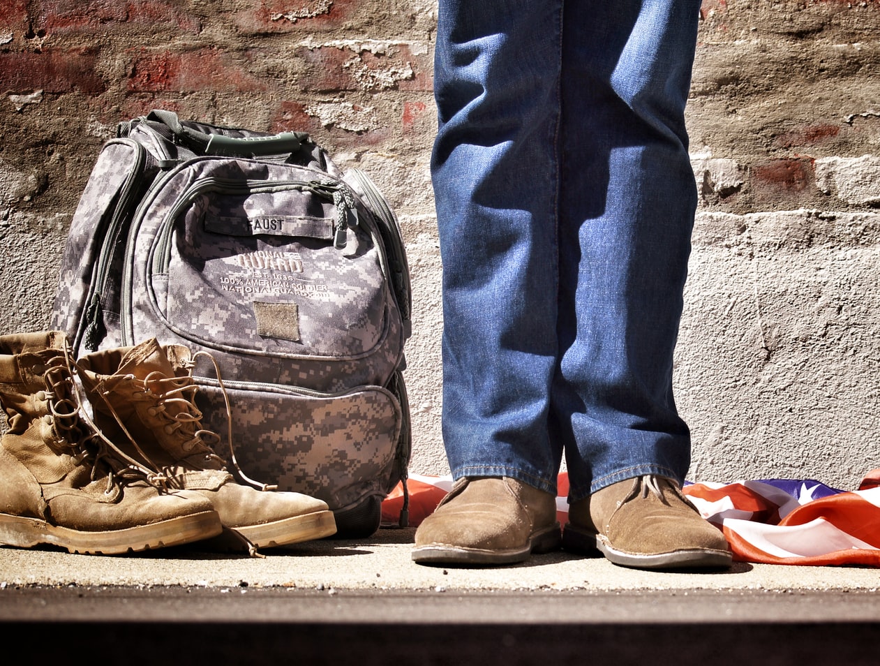 A veteran standing next to his military gear. It is not uncommon for veterans to suffer from substance abuse