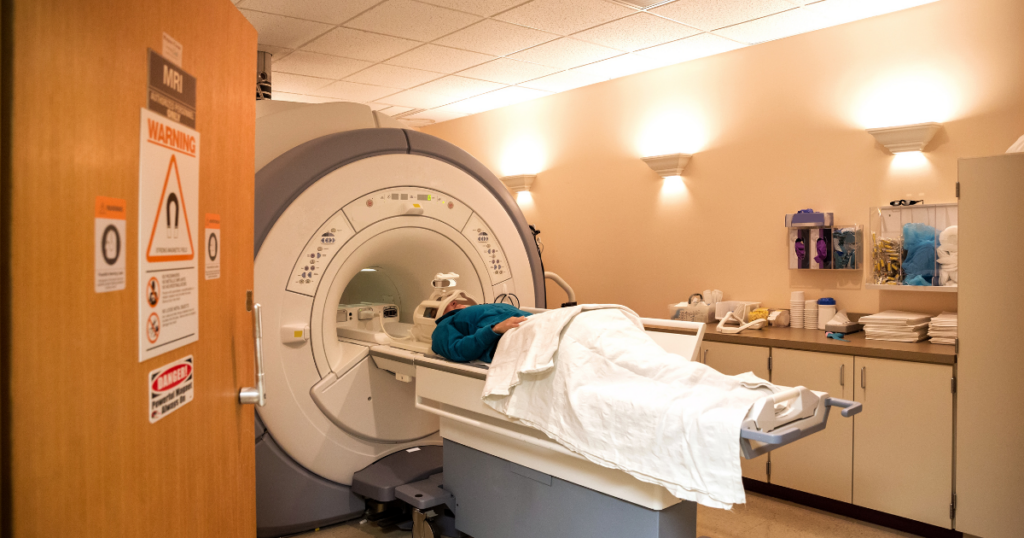A woman getting an MRI for cancer. Alcohol rehabs in Oklahoma can help people who are dealing with alcoholism and at risk of alcoholic cancer.