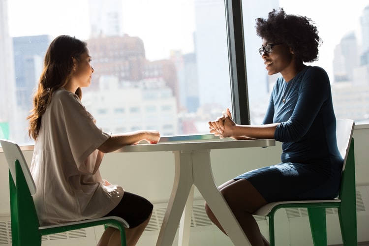 Two women undergoing a motivational therapy session