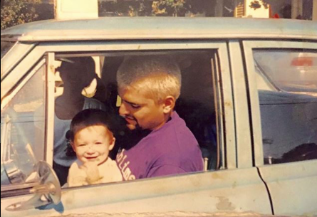 Bradley Nowell in the driver seat with his young child.