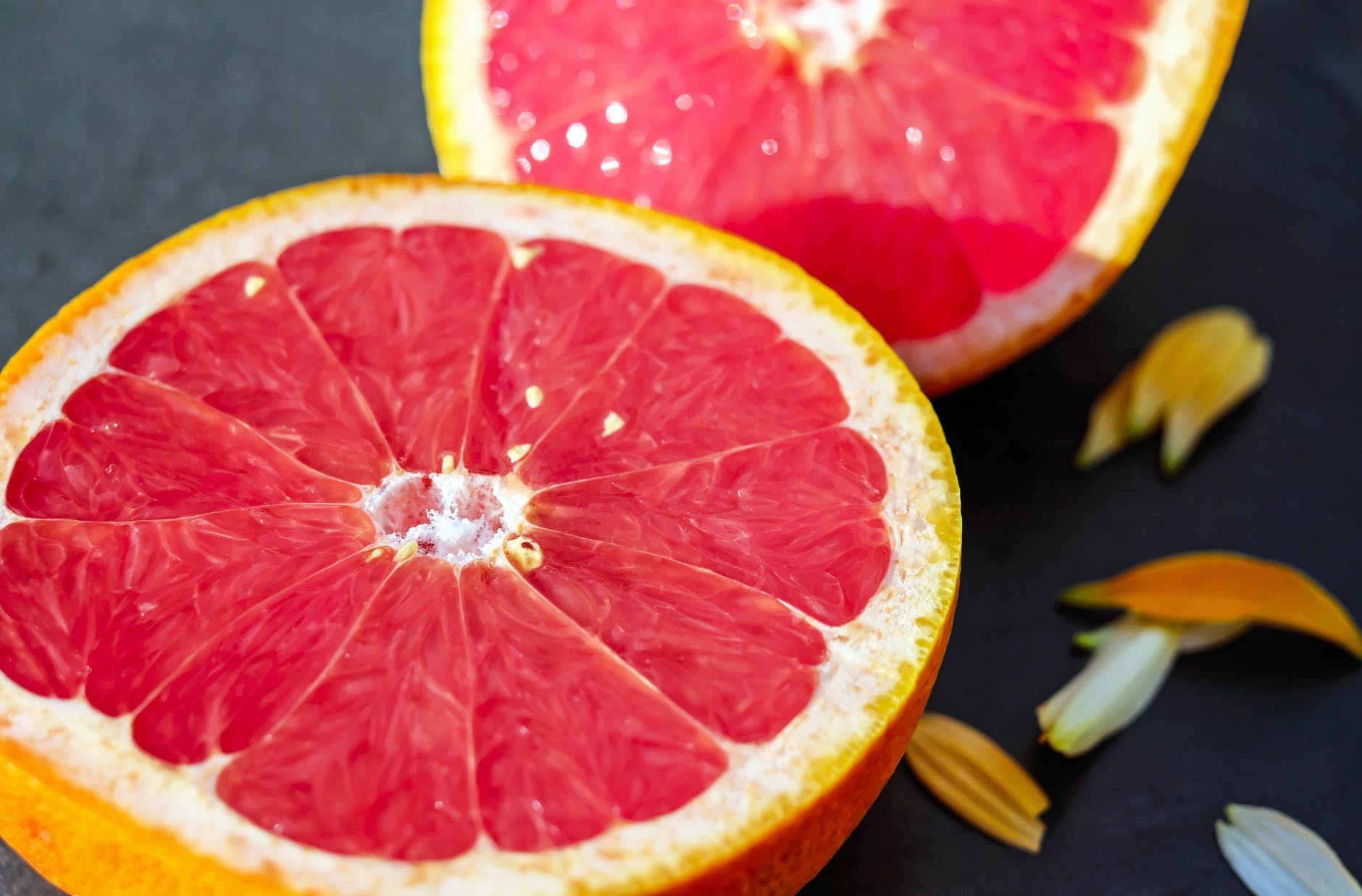 A sliced grapefruit. Grapefruit is used in many alcohol free drinks