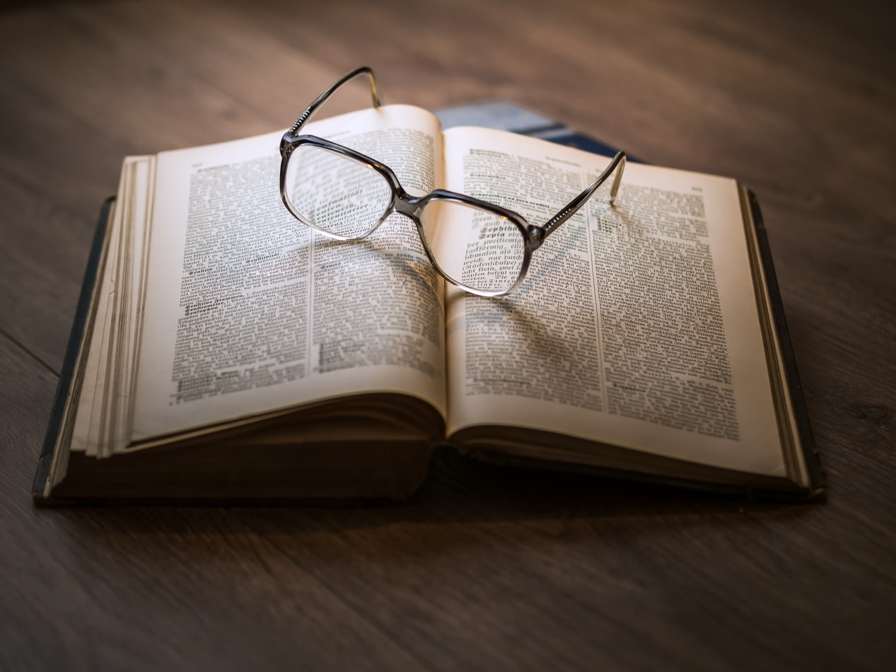 A pair of glasses on a book