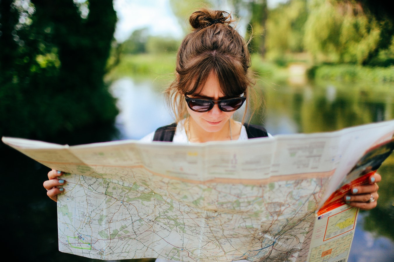 A woman looking at a map to find sober activities in kentucky
