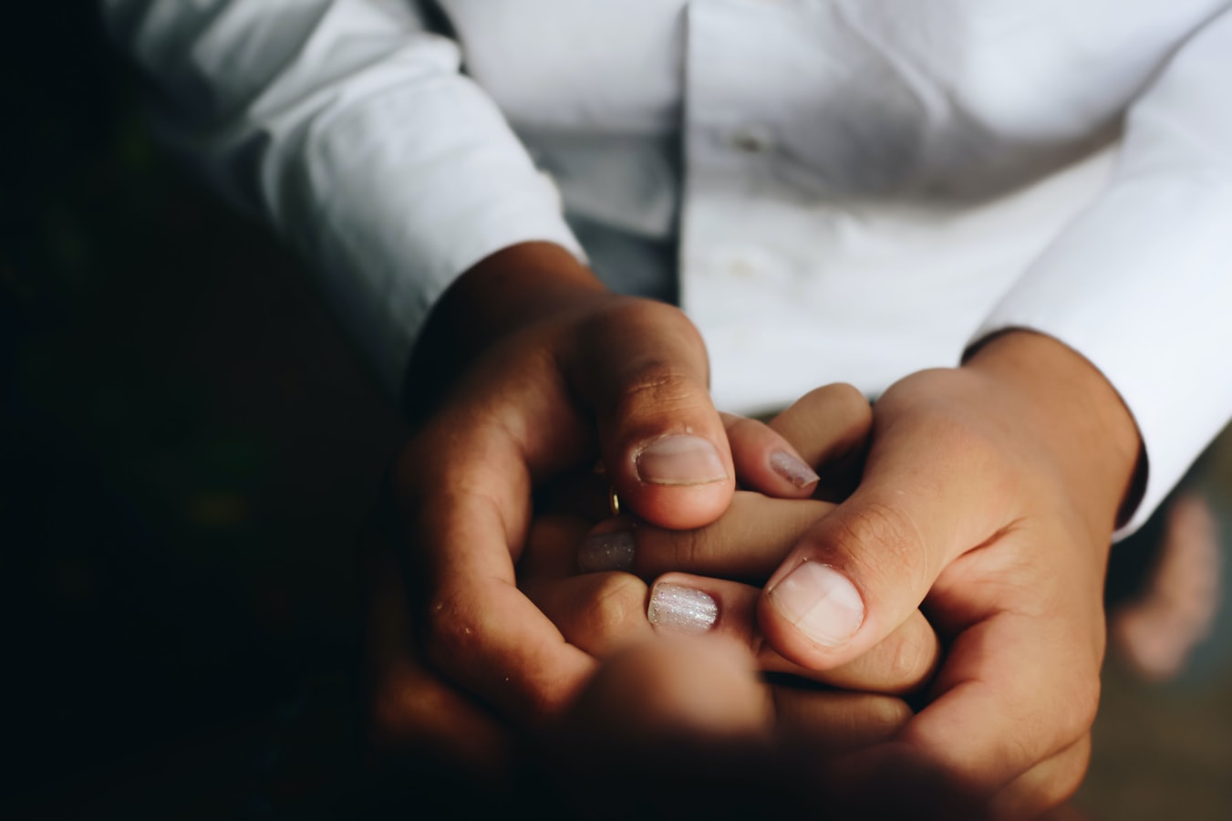 A doctor holding the hands of an individual undergoing addiction treatment