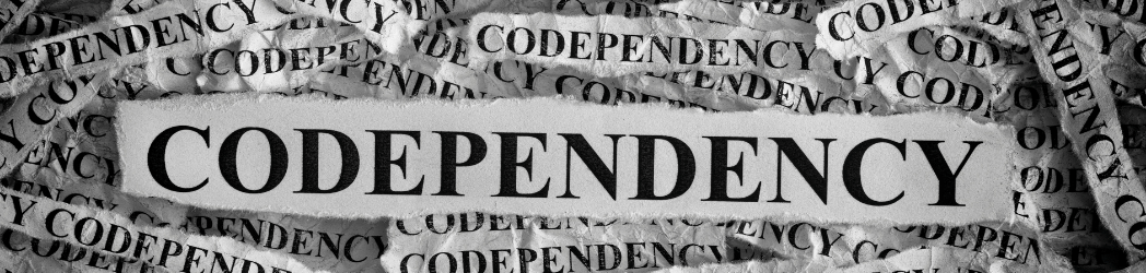 A pile of newspaper clippings that all have the word codependency on them, which takes the focus off substance abuse treatment.