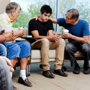 Elders helping a younger family member to seek substance abuse treatment at Landmark Recovery.