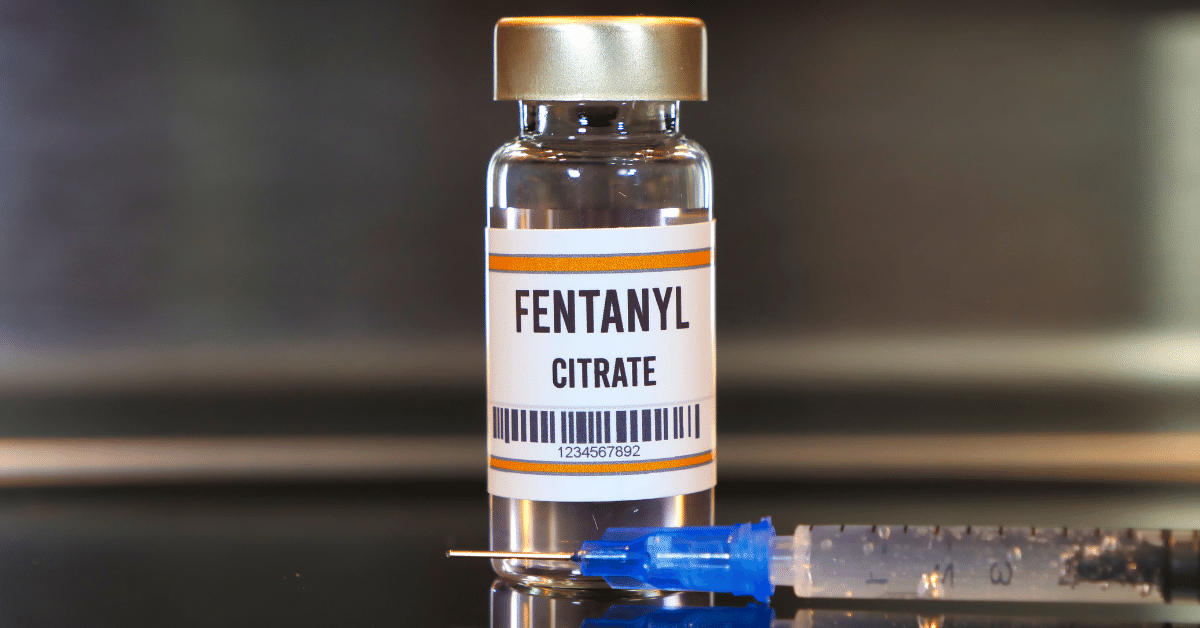 Small vial of fentanyl sits next to a needle, alluding to the fentanyl overdose grief uptrend.