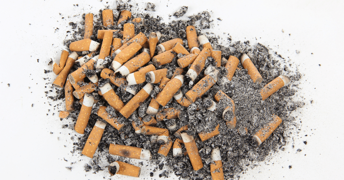 A pile of cigarette butts in ashes illustrate someone's nicotine addiction; what made the FDA ban menthol cigarettes?