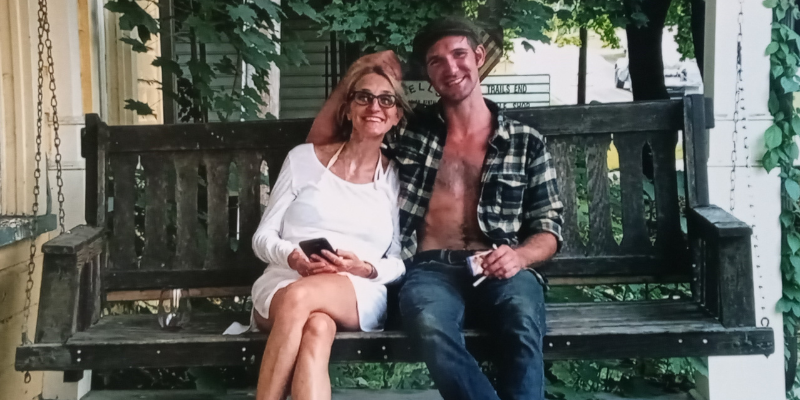 Stephanie Defelicibus and Patrick Kilbane sitting on a porch swing