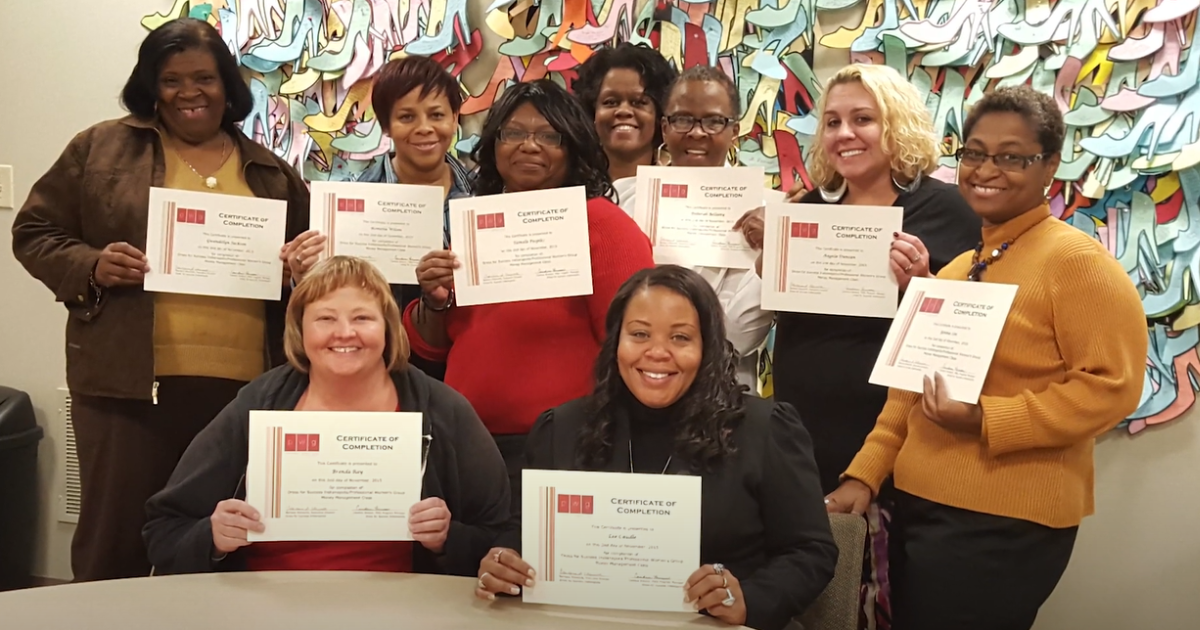 women holding their certificates of completion after a career development class at dress for success indianapolis