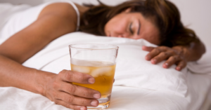 Jane Doe has alcohol use disorder and drinks too much in order to fall asleep but also drinks more when she wakes up.