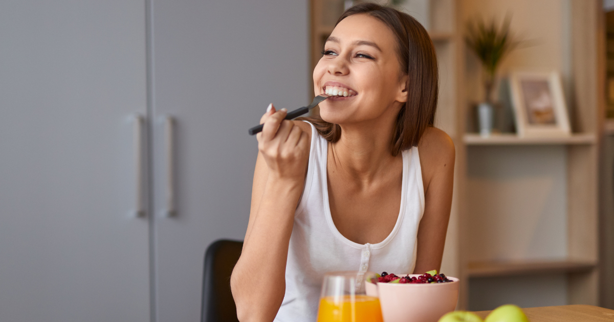 a woman in early addiction recovery eating food to help elevate her mood