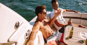 Two guys on a boat enjoying life because they're comfortable in their own skin, which comes from living a life free of addiction.