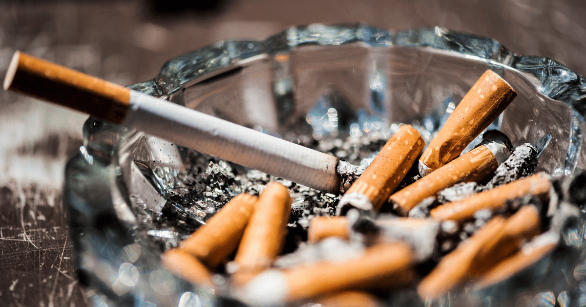 Cigarette butts in an ashtray, smoking after someone in rehab for substance use disorder just smoked.