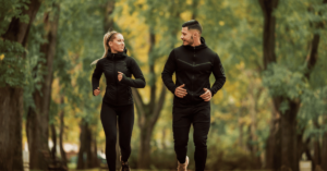 Couple jogging because they're pursuing a healthy lifestyle by substituting substance use disorders with exercise and other positive routines.
