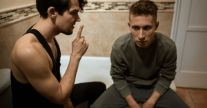 A manipulative substance abuser manipulates his friend into being complicit in a lie by being quiet about something among other loved ones. Manipulation is a hallmark of substance abuse disorder simply because addiction changes behavior. He's turning his friend into an enabler.