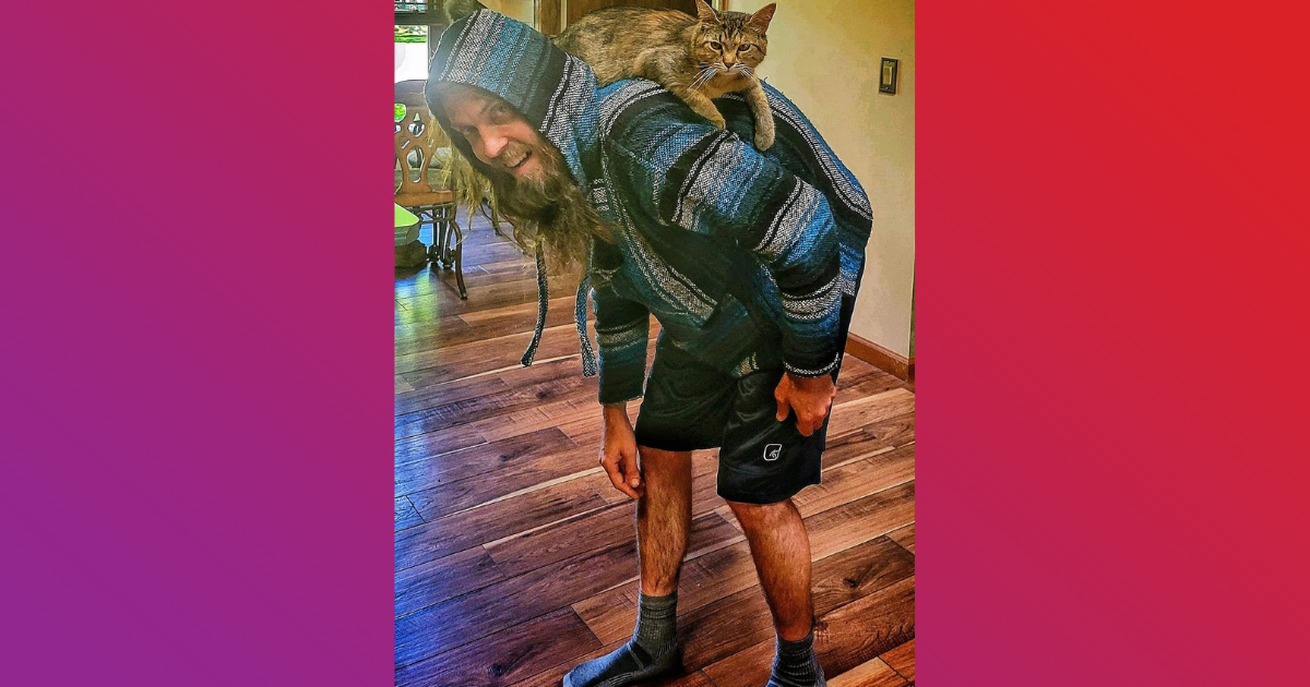 praxis of fort wayne addiction treatment center alumni luke lines is pictured with a cat