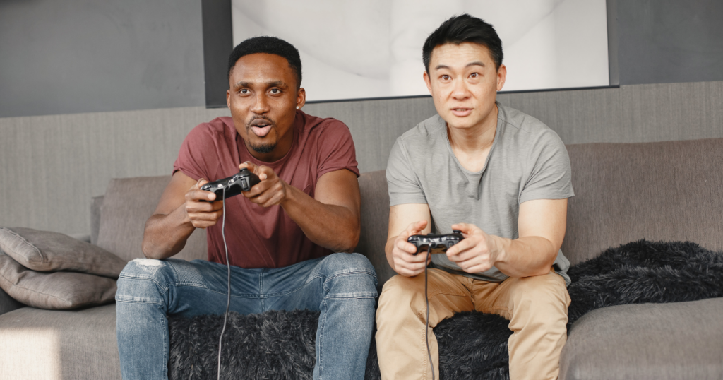 two men in addiction recovery play video games during a sober bachelor party