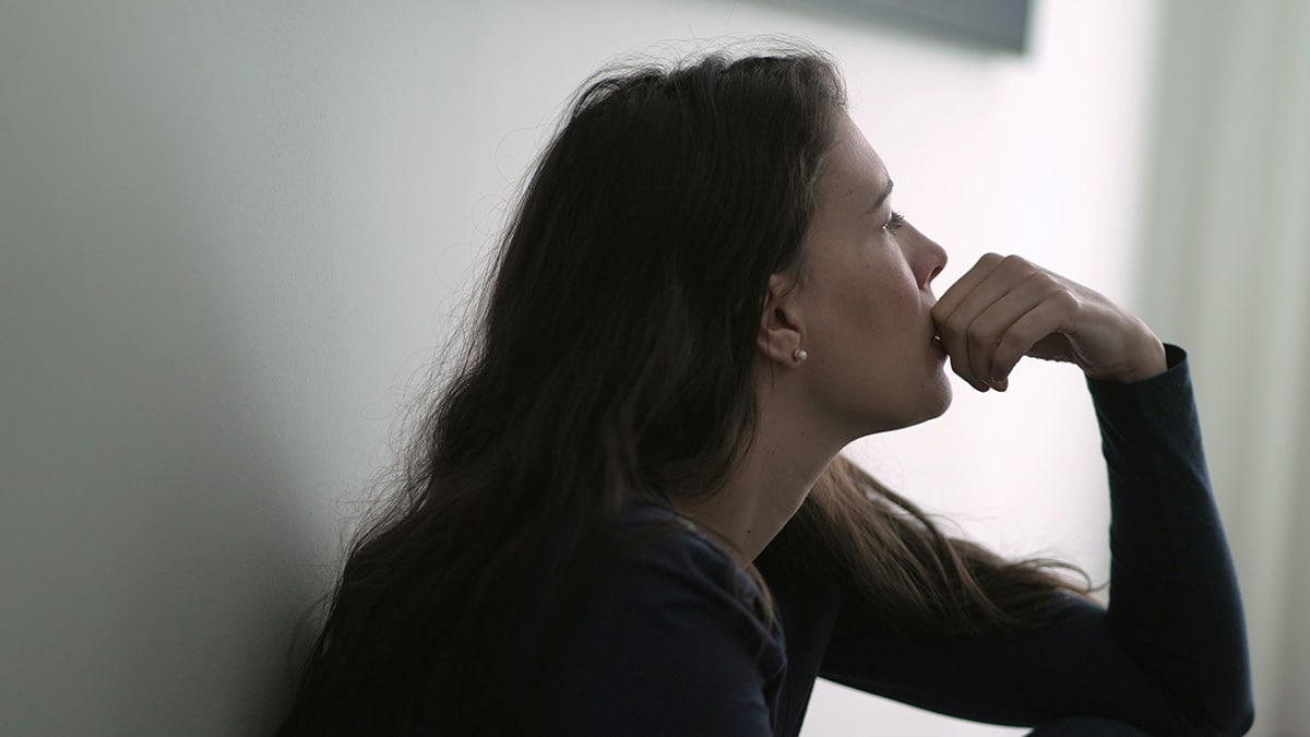 person sitting pensively thinking about naltrexone and its duration