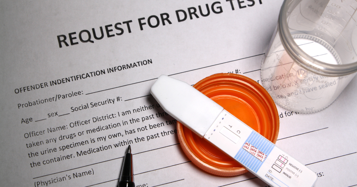 a drug test sits on top of a probation court document for involuntary rehab
