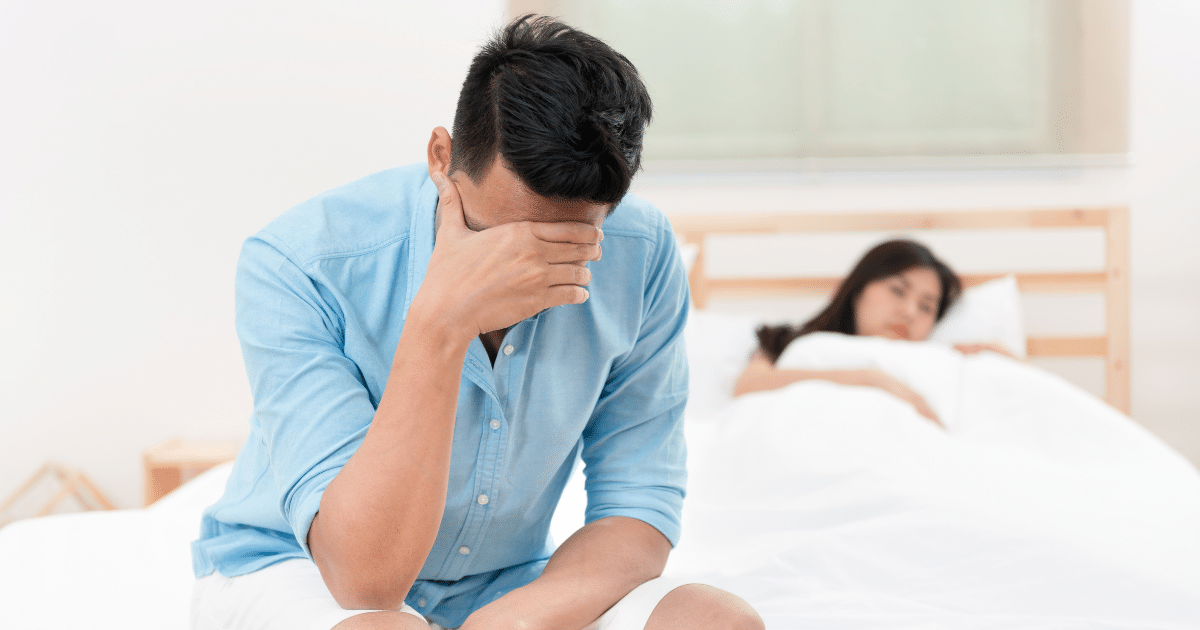 a man sits in bed sexually affected by trazodone